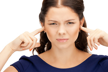 Image showing woman with fingers in ears