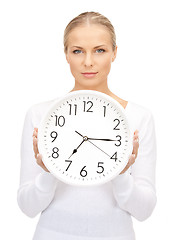 Image showing woman holding big clock