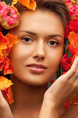 Image showing lovely woman with red flowers