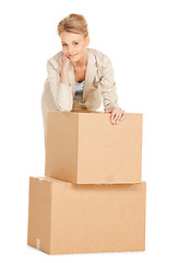 Image showing attractive businesswoman with big boxes