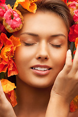 Image showing lovely woman with red flowers