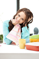 Image showing lovely housewife at the kitchen