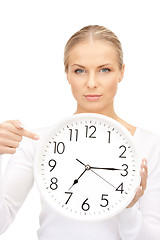 Image showing woman holding big clock