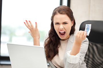 Image showing unhappy woman with computer and euro cash money