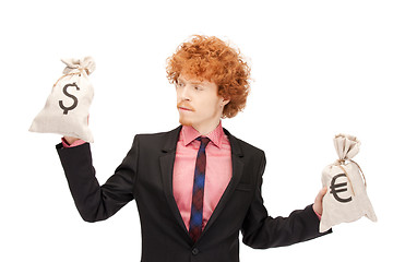 Image showing man with euro and dollar bags