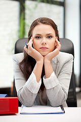 Image showing calm woman with big notepad