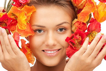 Image showing lovely woman with red flowers