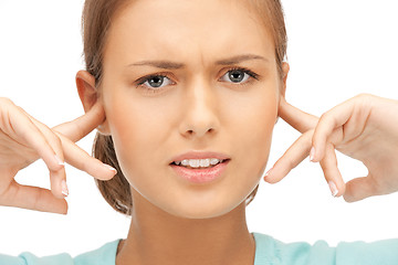 Image showing woman with fingers in ears