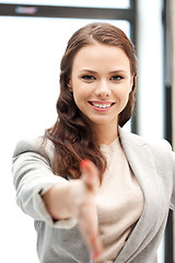 Image showing woman with an open hand ready for handshake