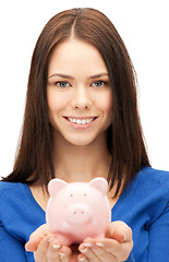 Image showing lovely woman with piggy bank