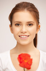 Image showing beautiful woman with red flower