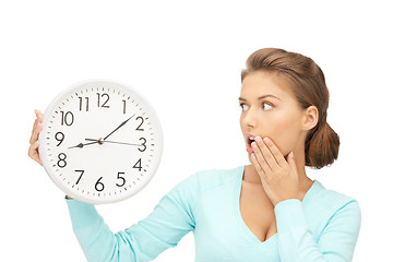 Image showing woman holding big clock