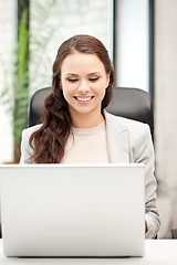 Image showing happy woman with laptop computer