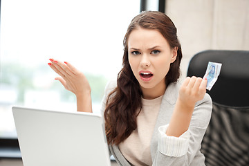 Image showing unhappy woman with computer and euro cash money