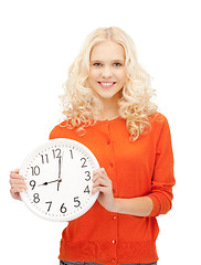 Image showing woman holding big clock