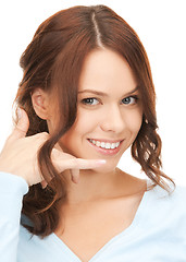 Image showing woman making a call me gesture