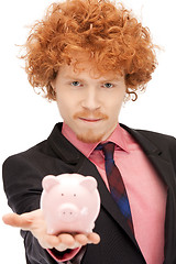 Image showing man with piggy bank