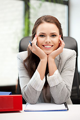 Image showing happy woman with big notepad