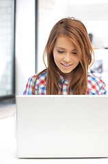 Image showing happy woman with laptop computer