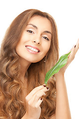 Image showing woman with green leaf