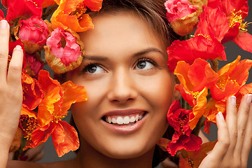 Image showing lovely woman with red flowers