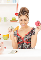 Image showing beautiful housewife with purse and money