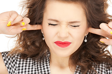 Image showing woman with fingers in ears