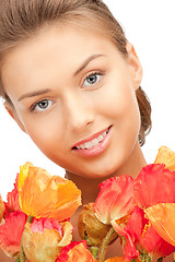 Image showing lovely woman with red flowers