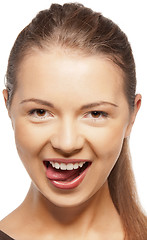 Image showing teenage girl sticking out her tongue