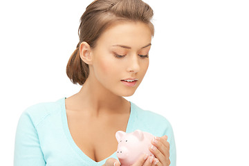 Image showing lovely woman with piggy bank