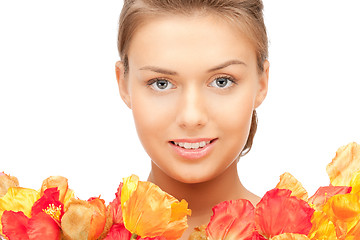 Image showing lovely woman with red flowers