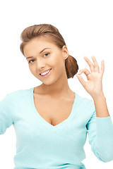 Image showing lovely teenage girl showing ok sign