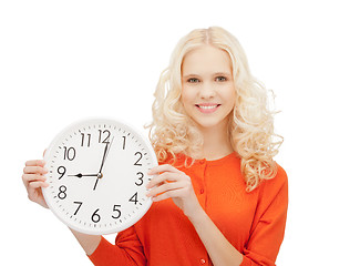 Image showing woman holding big clock