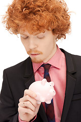 Image showing man with piggy bank