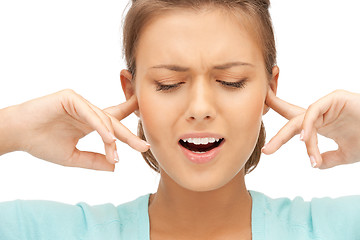 Image showing woman with fingers in ears