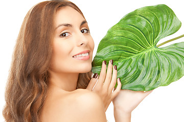 Image showing woman with green leaf