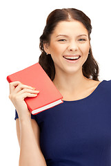 Image showing happy and smiling woman with book