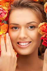 Image showing lovely woman with red flowers