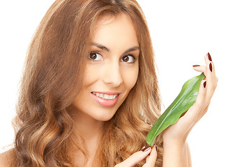 Image showing woman with green leaf