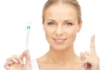 Image showing attractive female doctor with thermometer