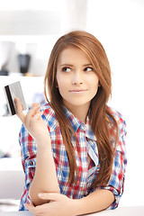 Image showing pensive woman with credit card