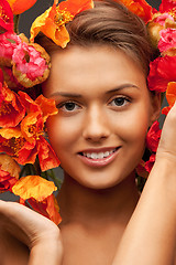 Image showing lovely woman with red flowers