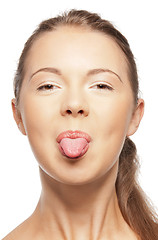 Image showing teenage girl sticking out her tongue