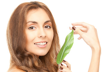 Image showing woman with green leaf