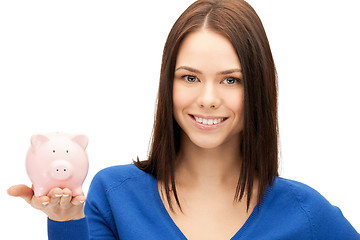 Image showing lovely woman with piggy bank