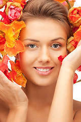 Image showing lovely woman with red flowers