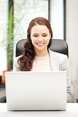 Image showing happy woman with laptop computer