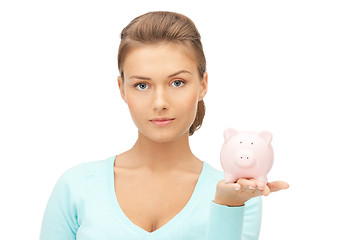 Image showing lovely woman with piggy bank