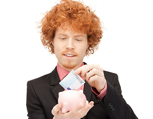 Image showing man with piggy bank and money