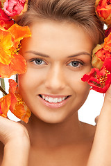 Image showing lovely woman with red flowers